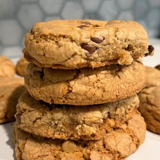 Butterscotch Toffee cookies stacked, with butterscotch chips and toffee bits